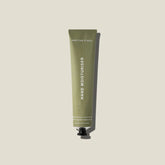 Hand moisturiser in a sage green coloured  tube with white background.