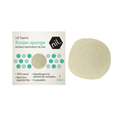 White konjac facial cleaning sponge with box packaging on white background.