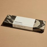 A box of Palo Santo incense on a beige surface. 