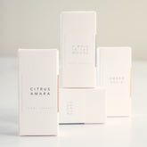 4 white boxes of the 4 scent therapy collection.