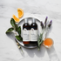 250mL bottles of Holistic Hair Sensitive shampoo and conditioner on white marble bench adorned with lavender flowers, orange slices, neroli blossoms and a beaker of apple cider vinegar.